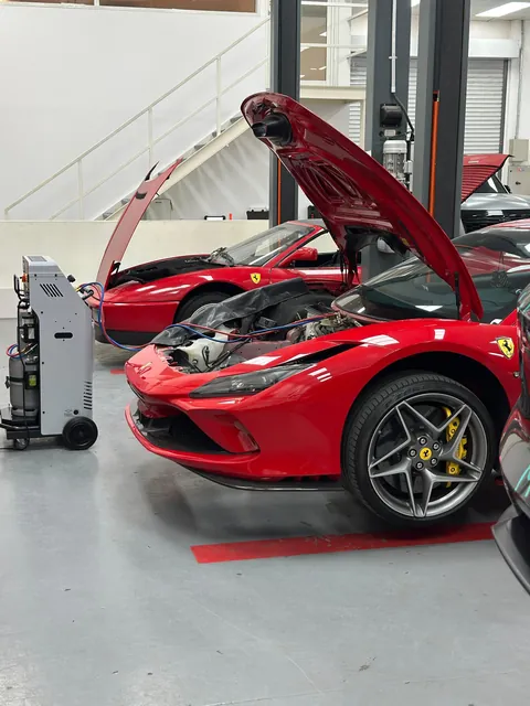 Ferrari F8 Tributo connected to an A/C service machine at OFJ Automotive