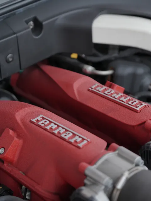 Ferrari V8 engine with red cam covers at OFJ Automotive