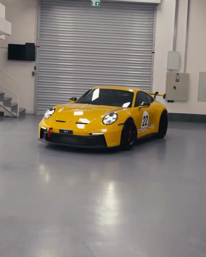 Porsche 911 GT3 in yellow peelable paint at OFJ Automotive, Al Quoz, Dubai