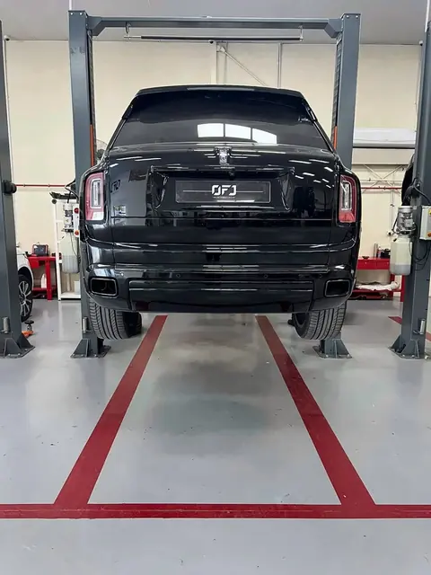 Rolls-Royce Cullinan raised on a lift for servicing at OFJ Automotive